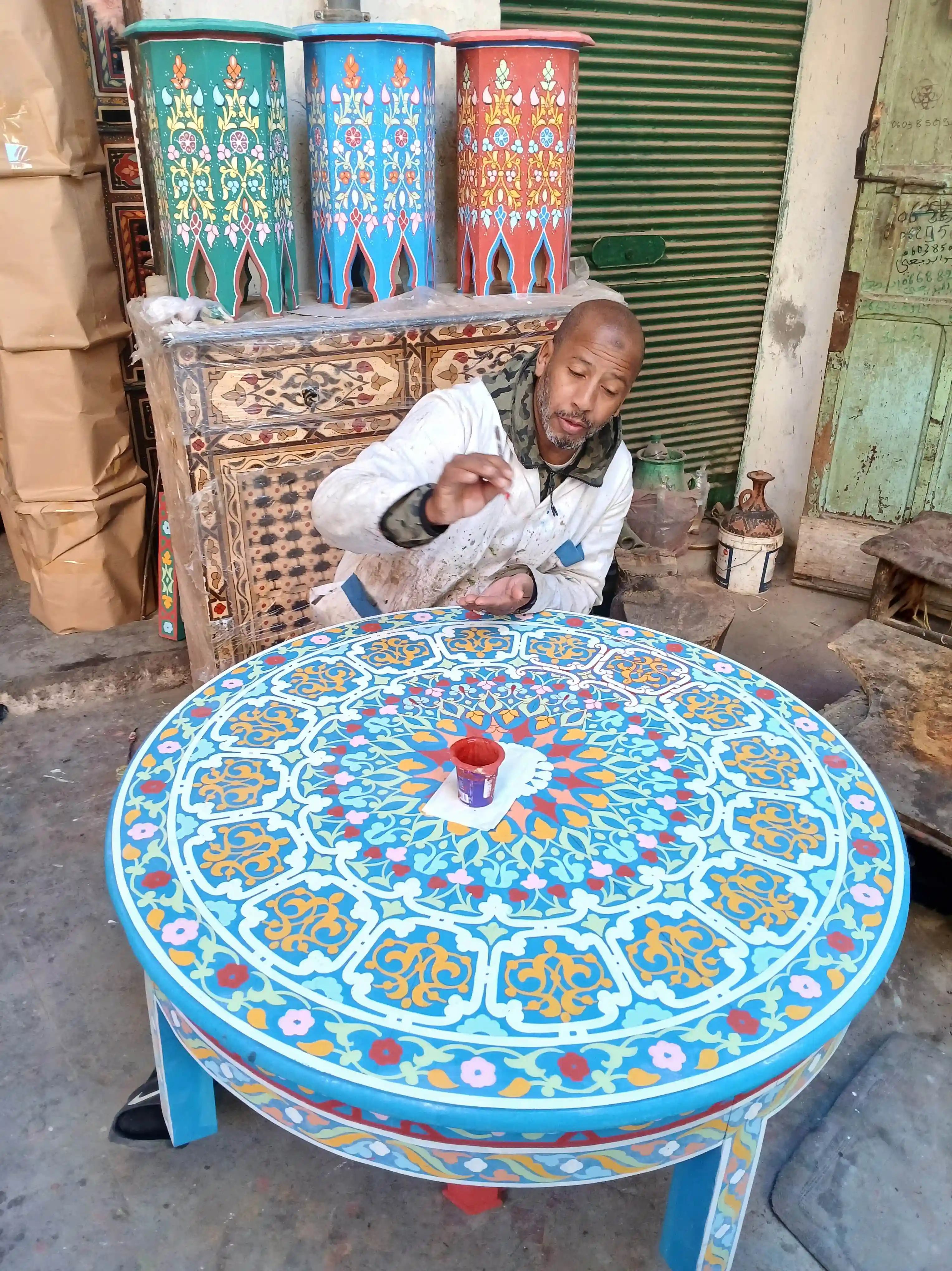 Applying paint to the wood